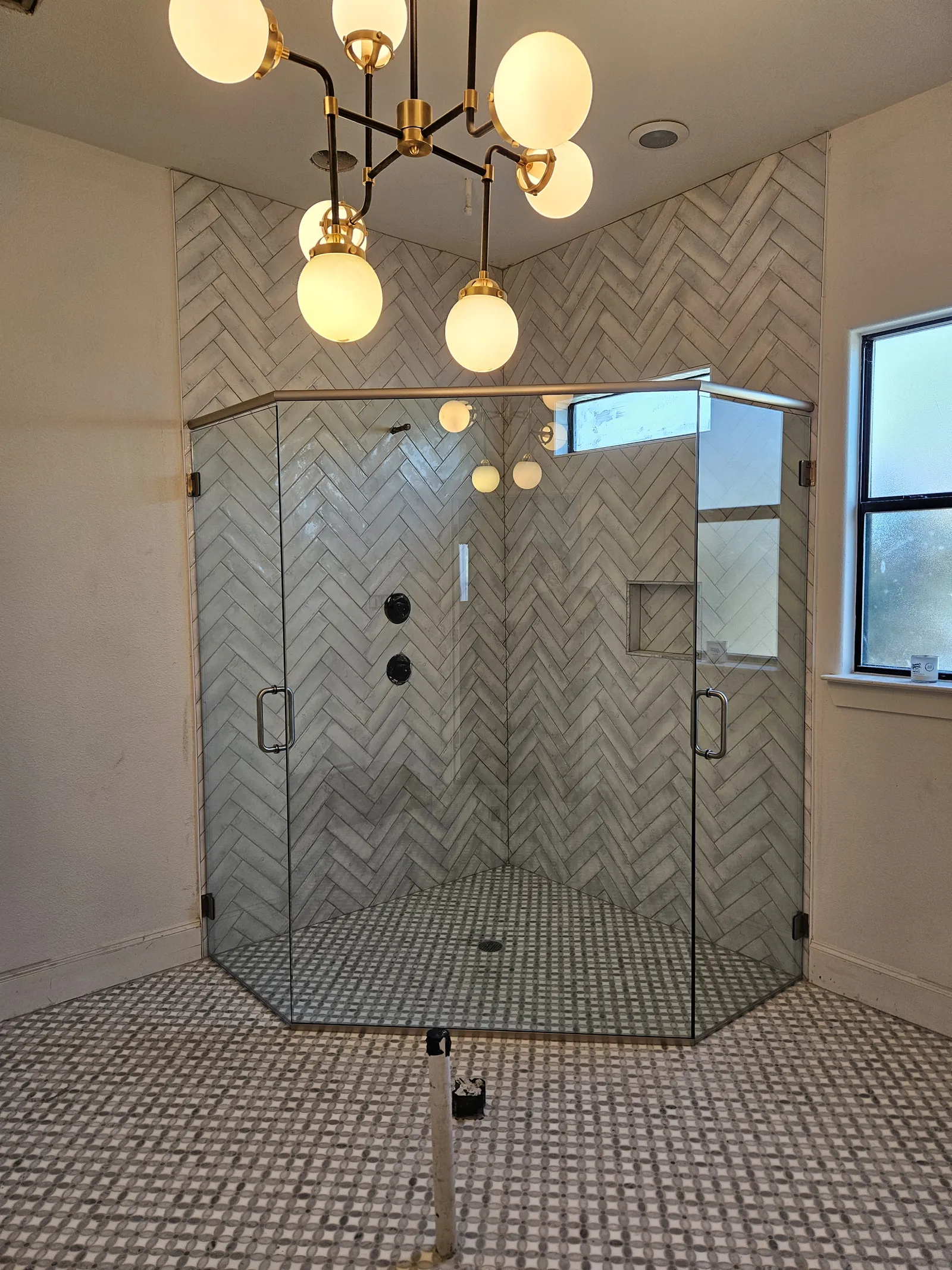 Frameless shower with matte black hardware