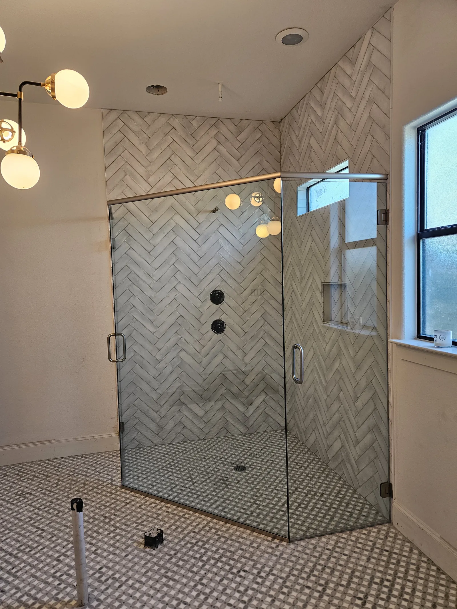 Large frameless shower enclosure with bench seat