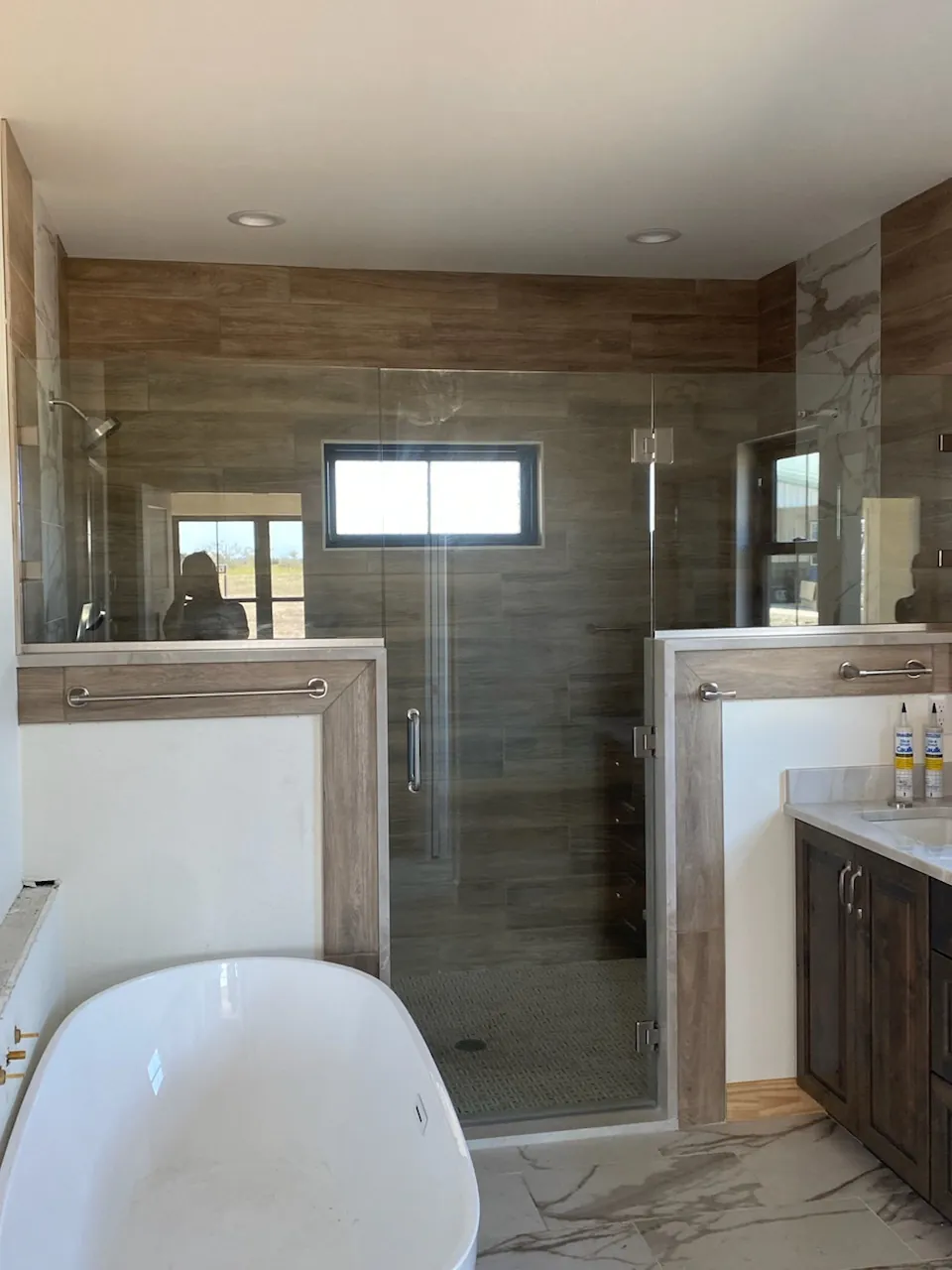 Frameless glass panel on a walk-in shower